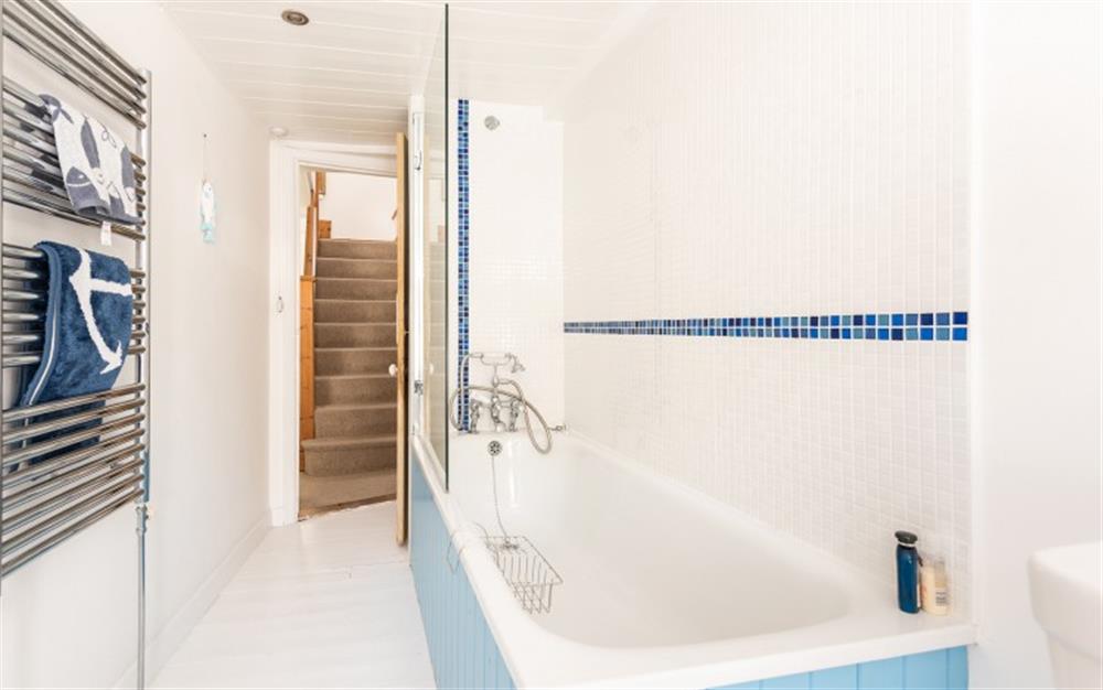 The family bathroom with shower over the bath at Bridgend House in Polperro