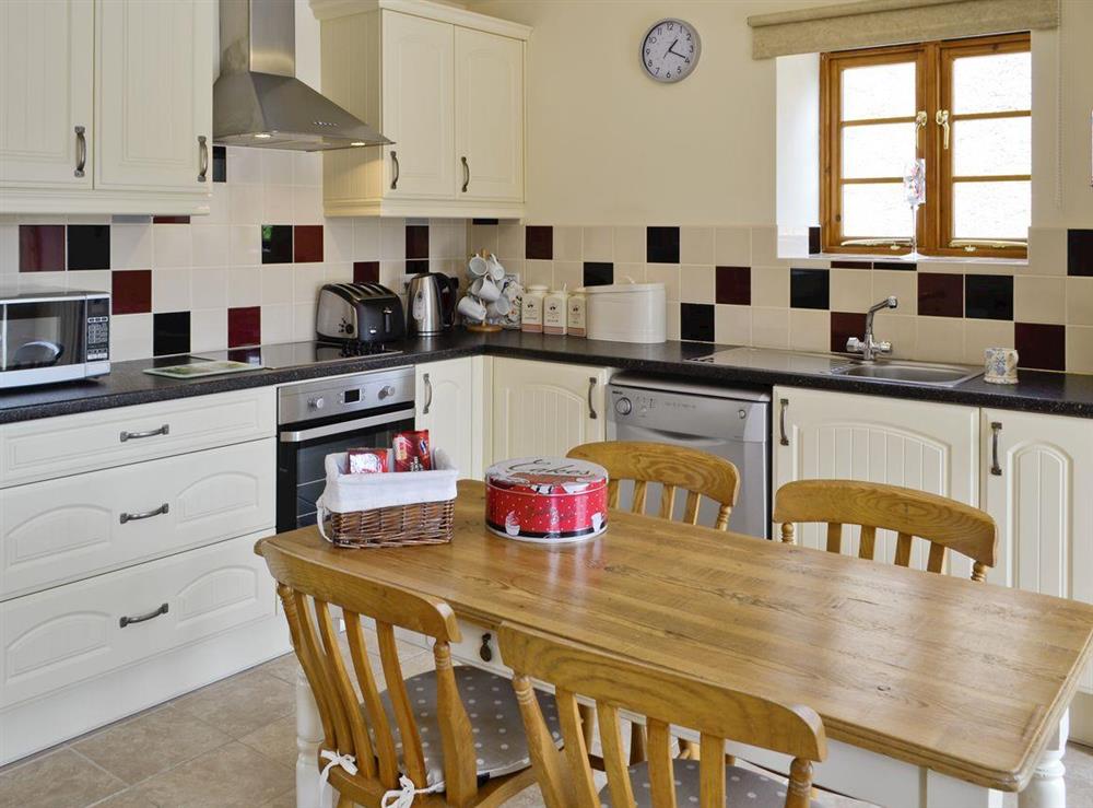 Well-equipped kitchen with dining area at Casterbridge, 