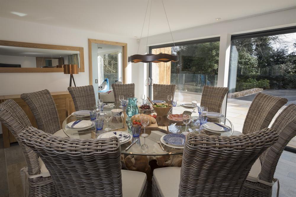 Beautiful glass dining table seating 10 guests comfortably