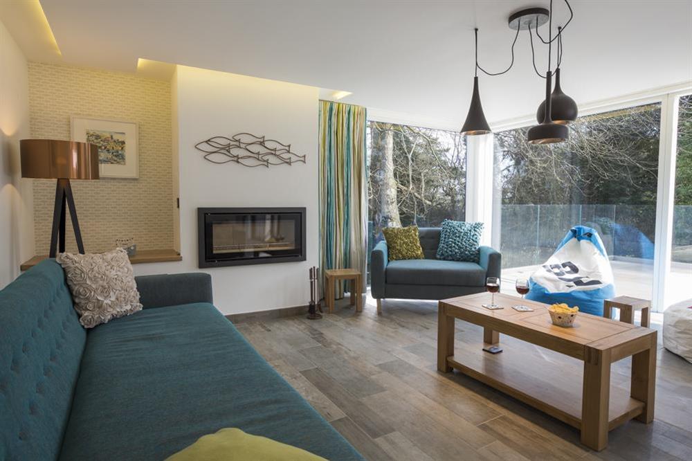 Bright and stylish living room with 'Studio 2' wood burning fire (photo 3) at Bridleway House in , Salcombe