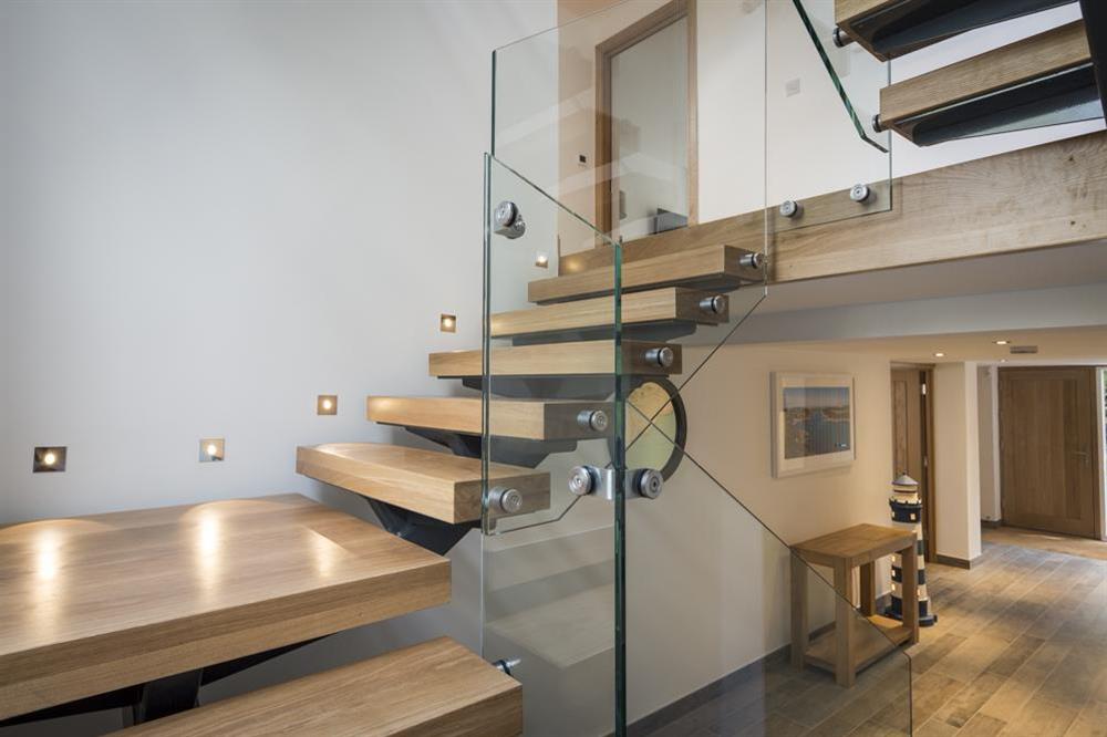 Oak and glass open tread staircase to first and second floors