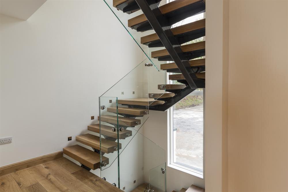 Oak and glass open tread staircase to first and second floors