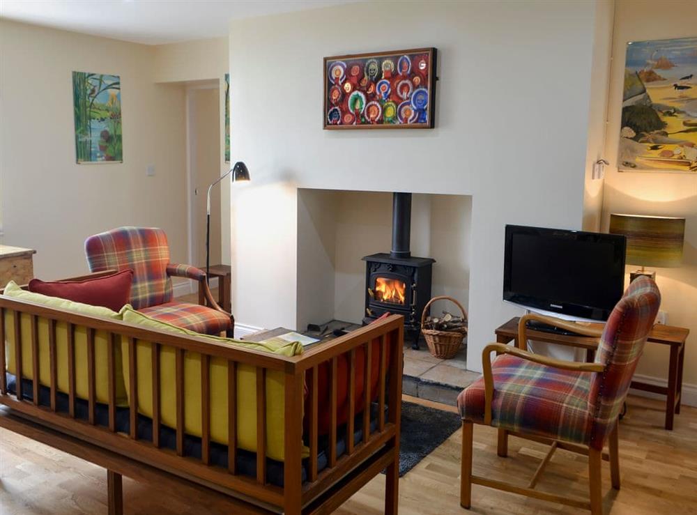 Relaxing living and dining room with multi-fuel burner at Brier Dene End Cottage in Old Hartley, near Whitley Bay , Tyne and Wear