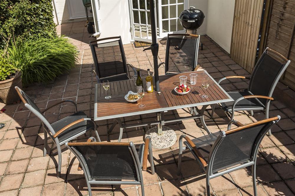 Lower terrace area with garden table, chairs and barbecue at Brierdene in , Salcombe