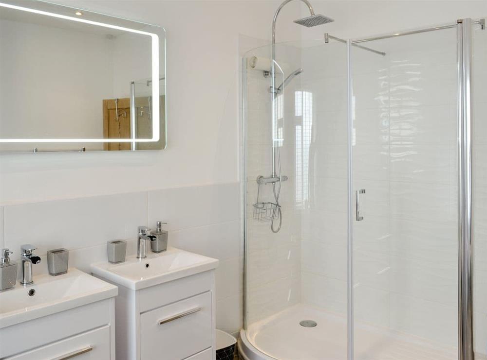 Family bathroom with bath and separate shower cubicle (photo 2) at Brig-y-Don, 
