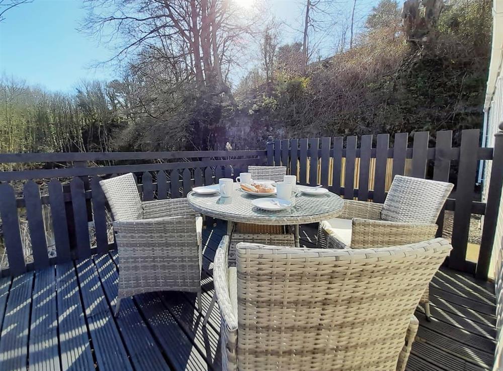 Private decking area overlooking pond and woodland at Graylings Rest, 