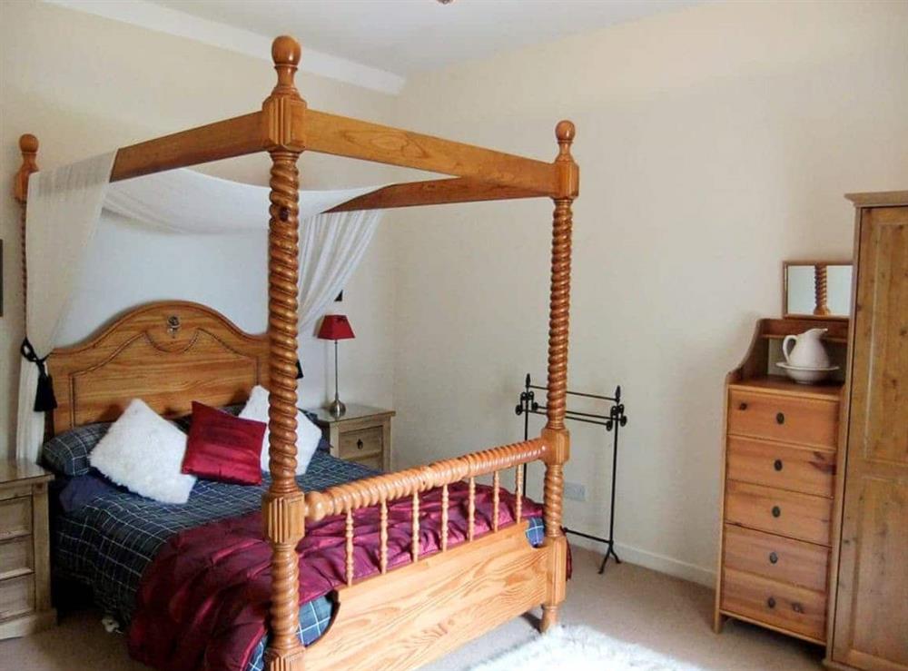Four Poster bedroom at Brightwater Cottage in Arnisdale, near Glenelg, Ross-Shire