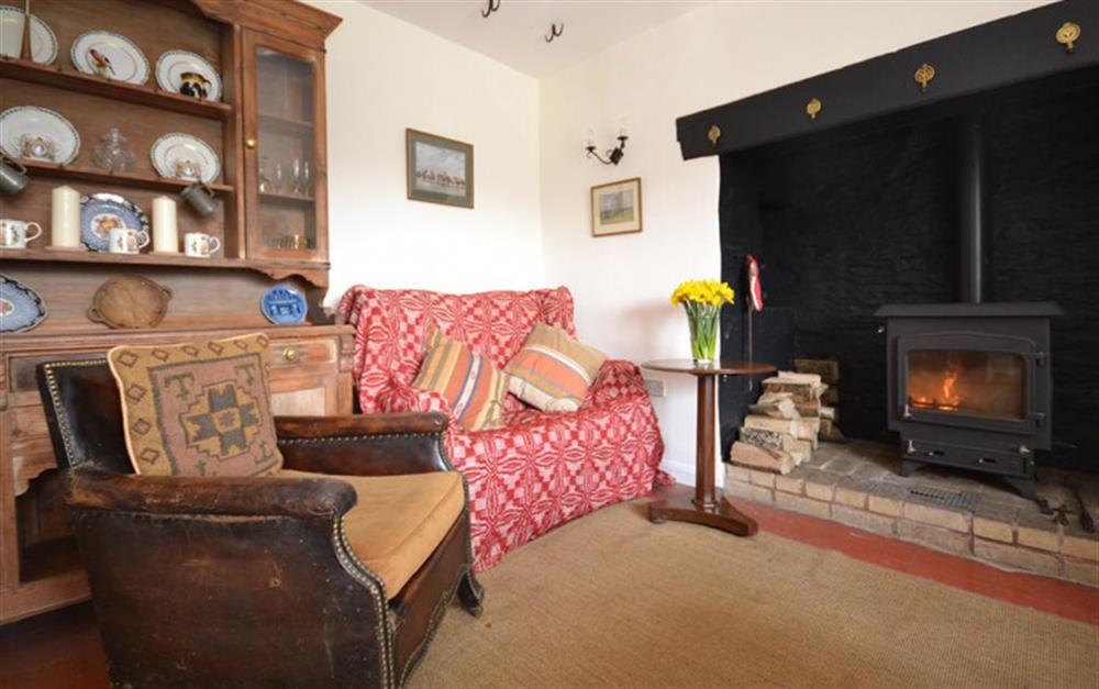 Snuggle up in front of the wood burner in the dining room. at Brightworthy Farm in Withypool