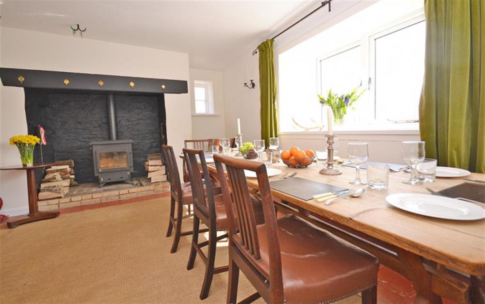 The dining room with feature inglenook fireplace. at Brightworthy Farm in Withypool