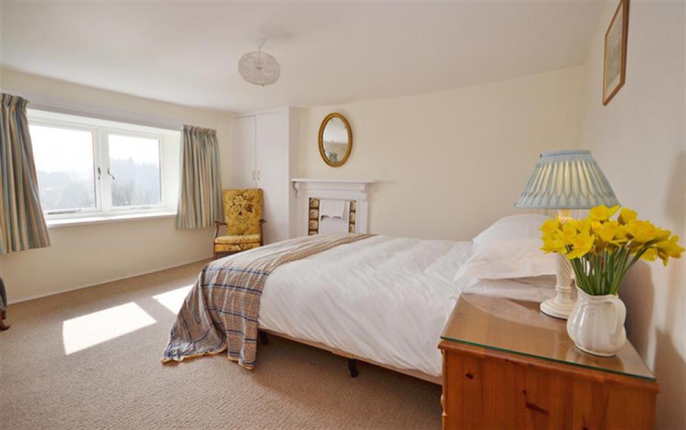 The master bedroom enjoys open moorland views. at Brightworthy Farm in Withypool