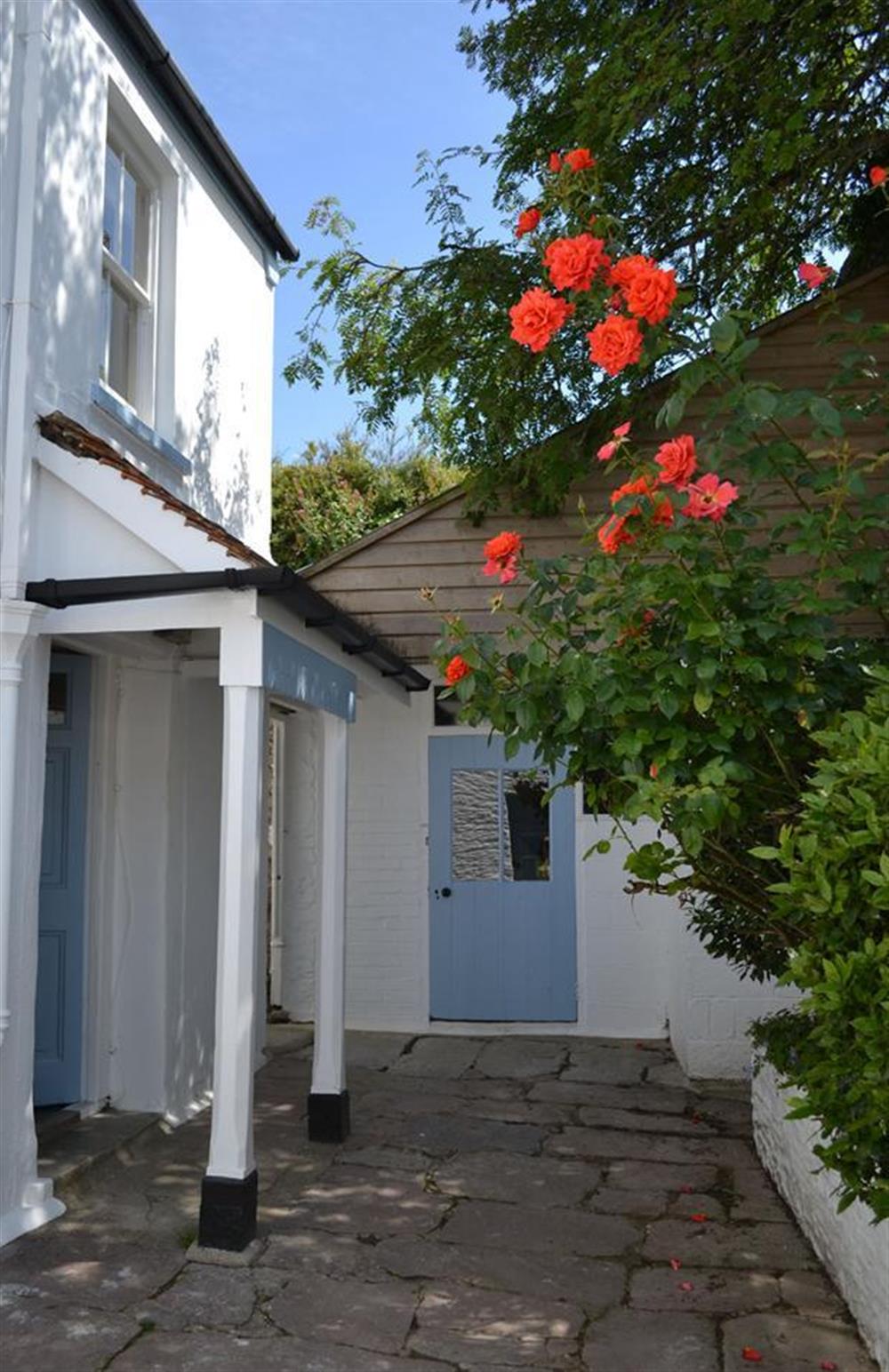 Front door and the enclosed courtyard at Britannia Cottage, Stoke Fleming