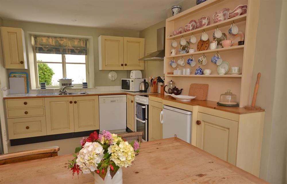 Kitchen with dining area at Britannia Cottage, Stoke Fleming