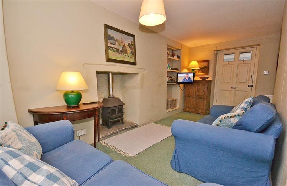 The comfortable sitting room with woodburner effect gas fire at Britannia Cottage, Stoke Fleming