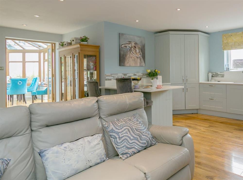 Spacious living area with open aspect to the conservatory at Brittons Hill Cottage in Kenardington, near Ashford, Kent