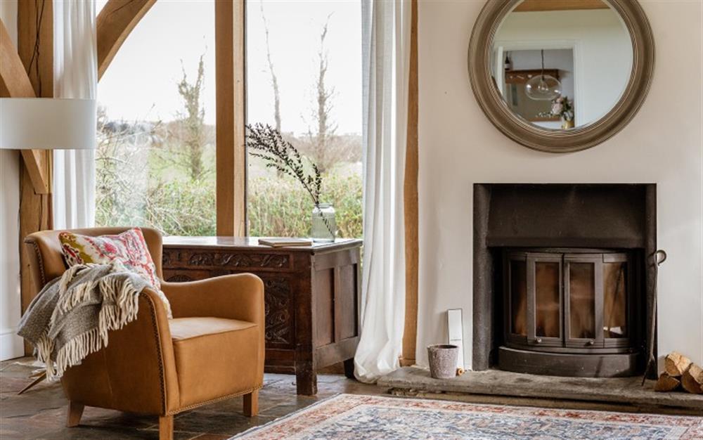 Relax in the living area at Broad Down Farmhouse in Malborough
