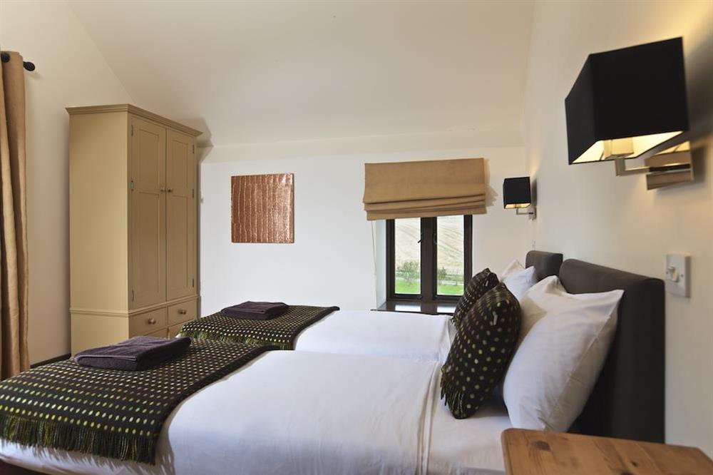 Bedroom four can be set up as a twin or a King-size double at Broad Downs Barn in Malborough, Nr Salcombe