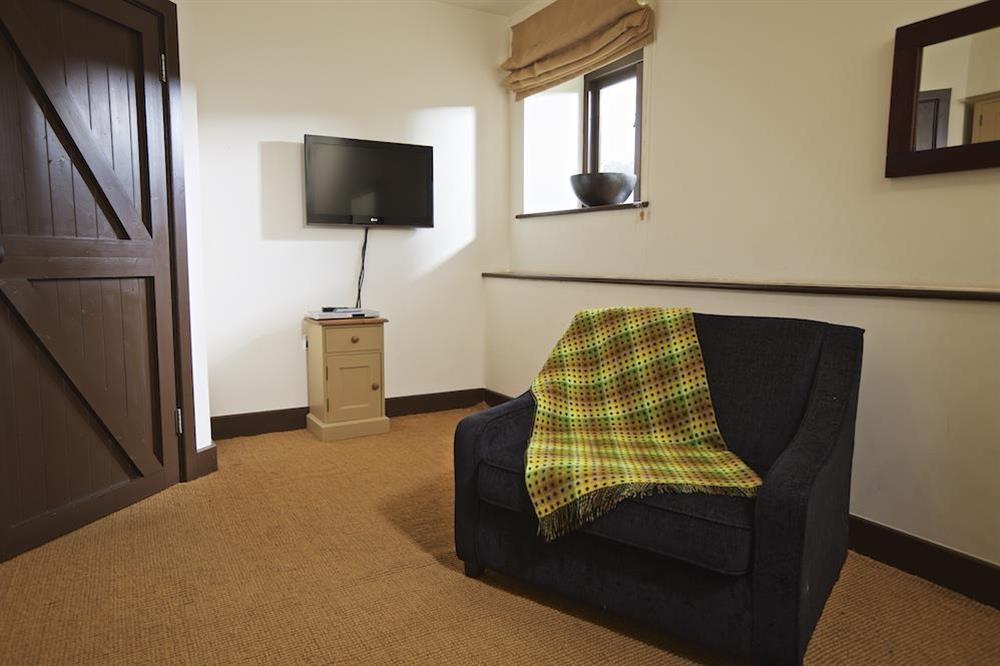 The sixth bedroom (for up to 4) can also be arranged as a TV/reception room as shown (photo 2) at Broad Downs Barn in Malborough, Nr Salcombe