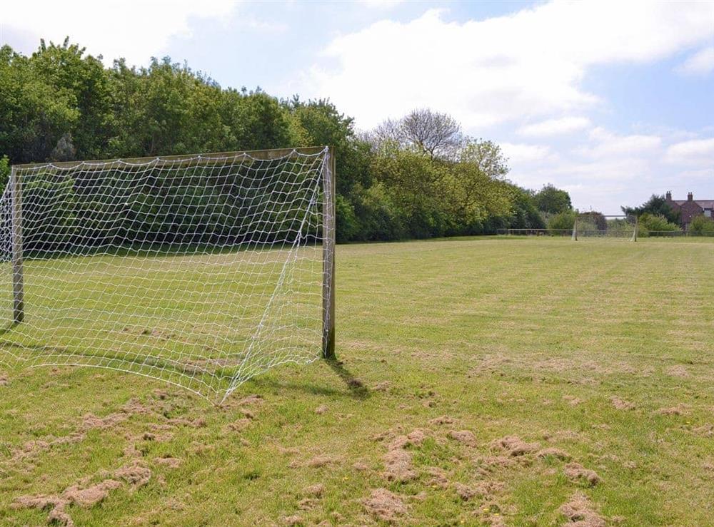 Large football field with goals within the shared grounds at Broad Leaf in Brandesburton, Nr Bridlington, East Yorkshire., North Humberside