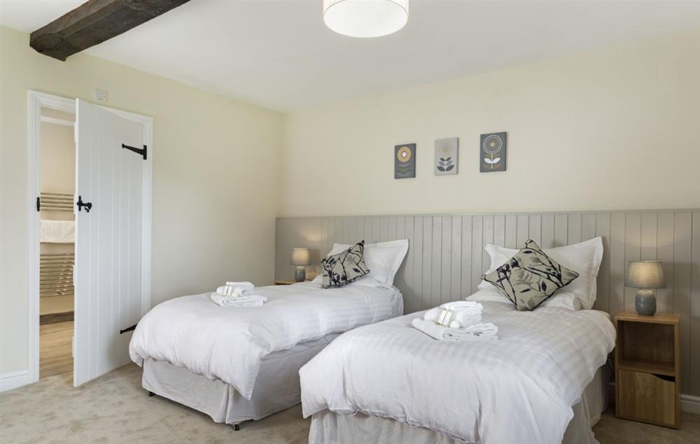 Bedroom with 6’ super king size zip and link beds (configured as a twin) with en-suite shower at Broad Meadows Farmhouse, Bayton
