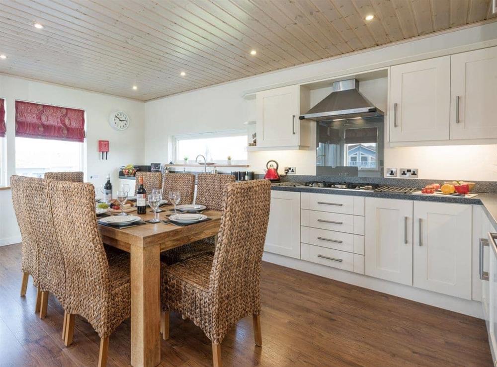 Well-equipped kitchen with dining area at Broad Reach in Fritton, near Great Yarmouth, Norfolk