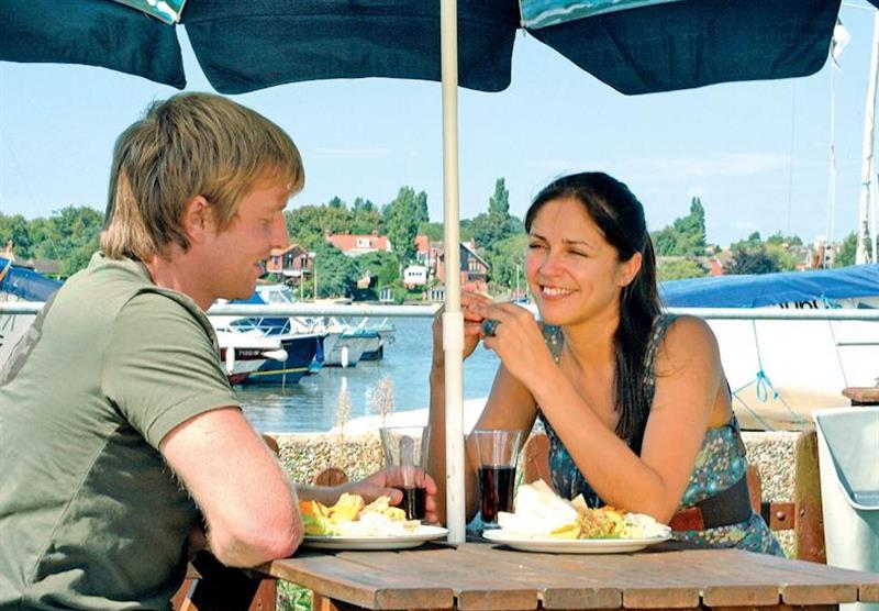 Enjoy a relaxing drink overlooking the Broads at Broadland Holiday Village in , Oulton Broad