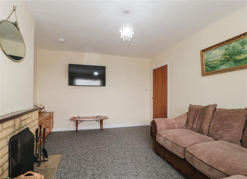 Relax in the living area at Broadlands Bungalow, Combe St Nicholas