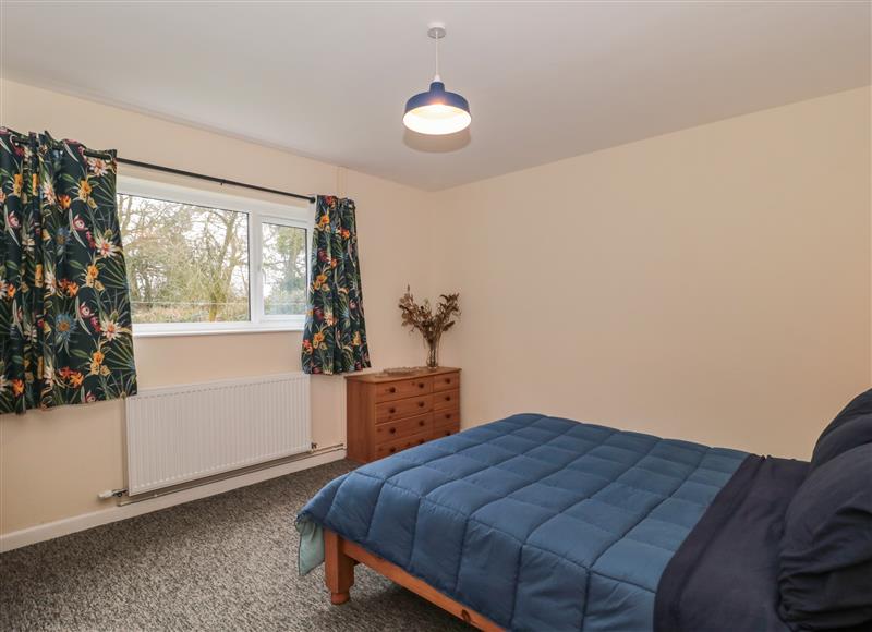 This is a bedroom (photo 2) at Broadlands Bungalow, Combe St Nicholas