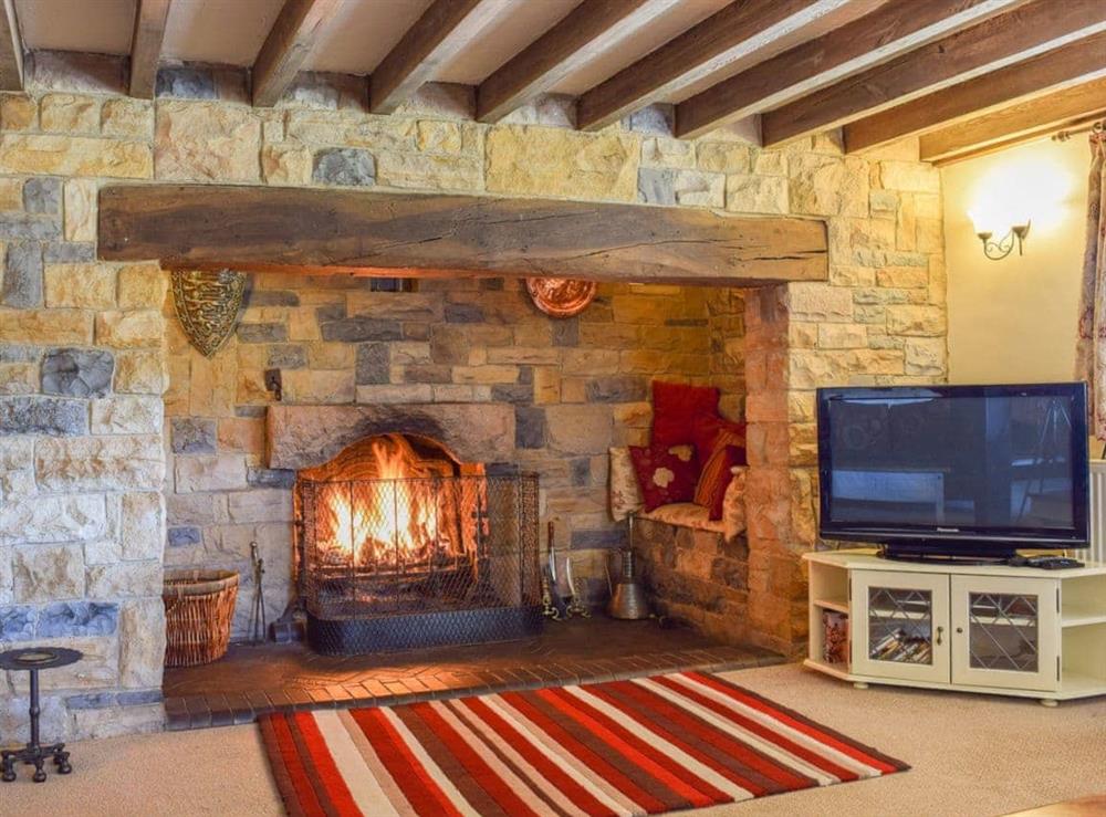 Beamed living room with walk-in Inglenook fireplace at Broadmeadows Farm in Butterton, Staffordshire., Great Britain