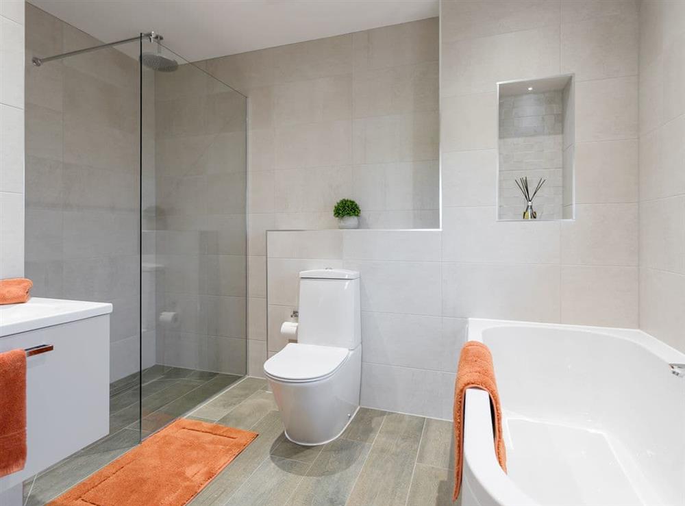 En-suite bathroom with bath and separate shower cubicle at The Hideaway, 