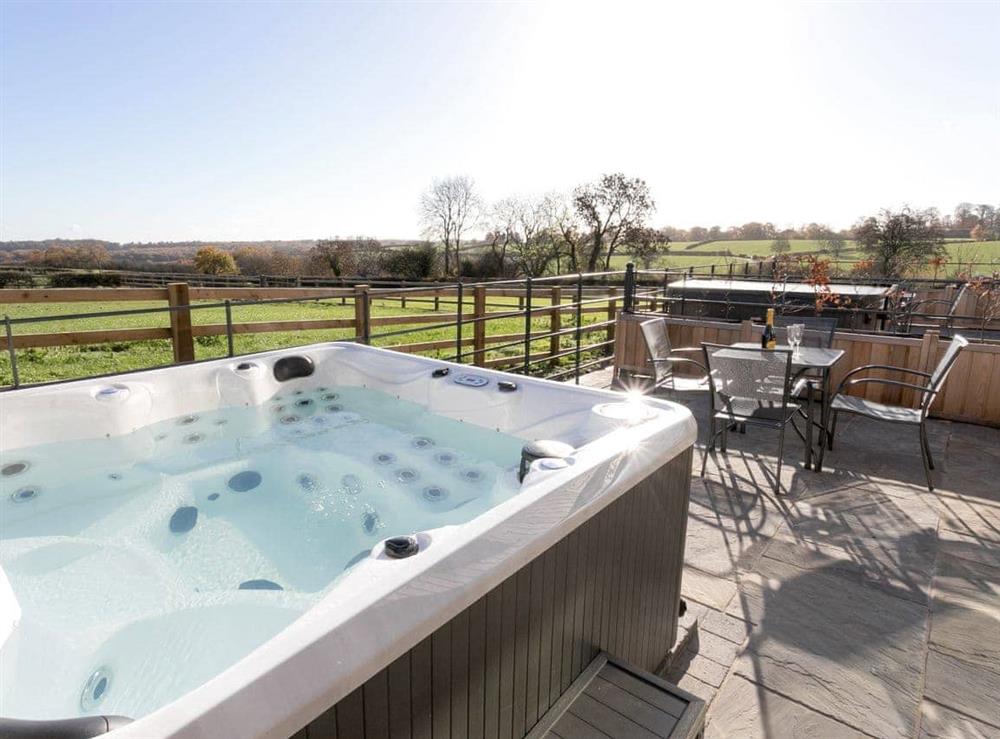 Luxurious hot tub on paved patio at The Retreat, 