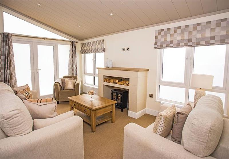 Living room in the Country Lodge Four VIP Platinum at Brokerswood Holiday Park in Southwick, Wiltshire