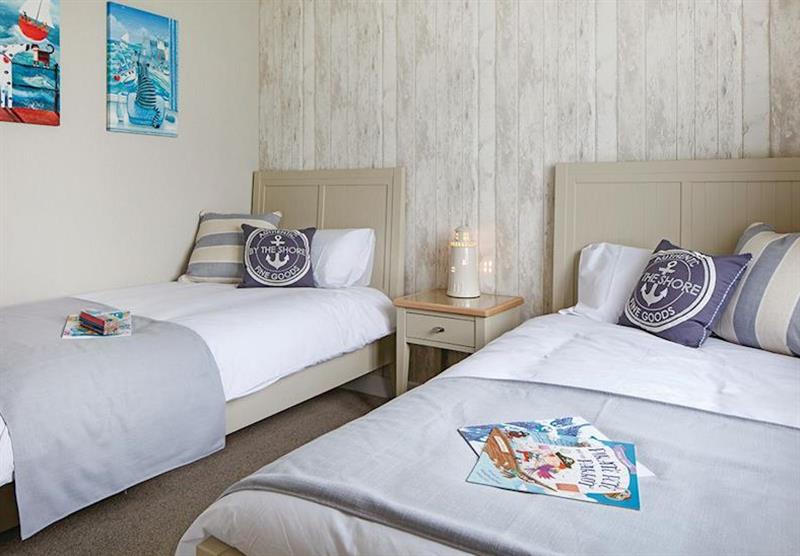 Twin bedroom in Country Lodge Six VIP Platinum at Brokerswood Holiday Park in Southwick, Wiltshire