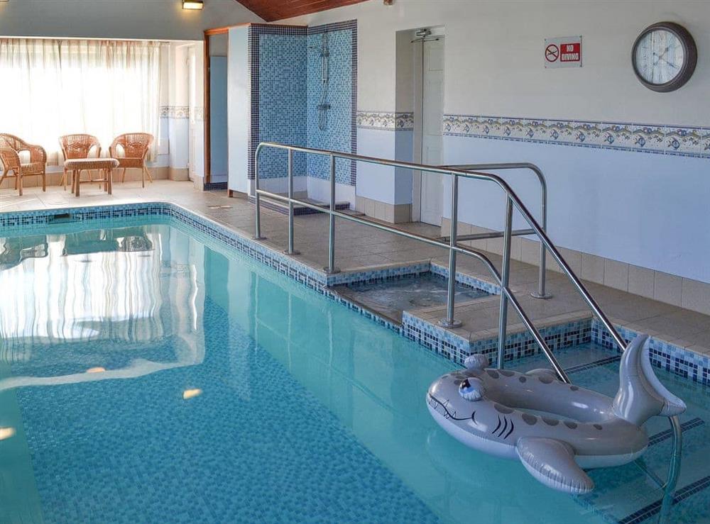 Indoor heated swimming pool with seating area at Brompton Lodge in Potter Brompton, Scarborough, N. Yorks., North Yorkshire
