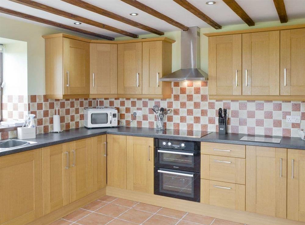 Fully-appointed kitchen at Llofft Storws, 