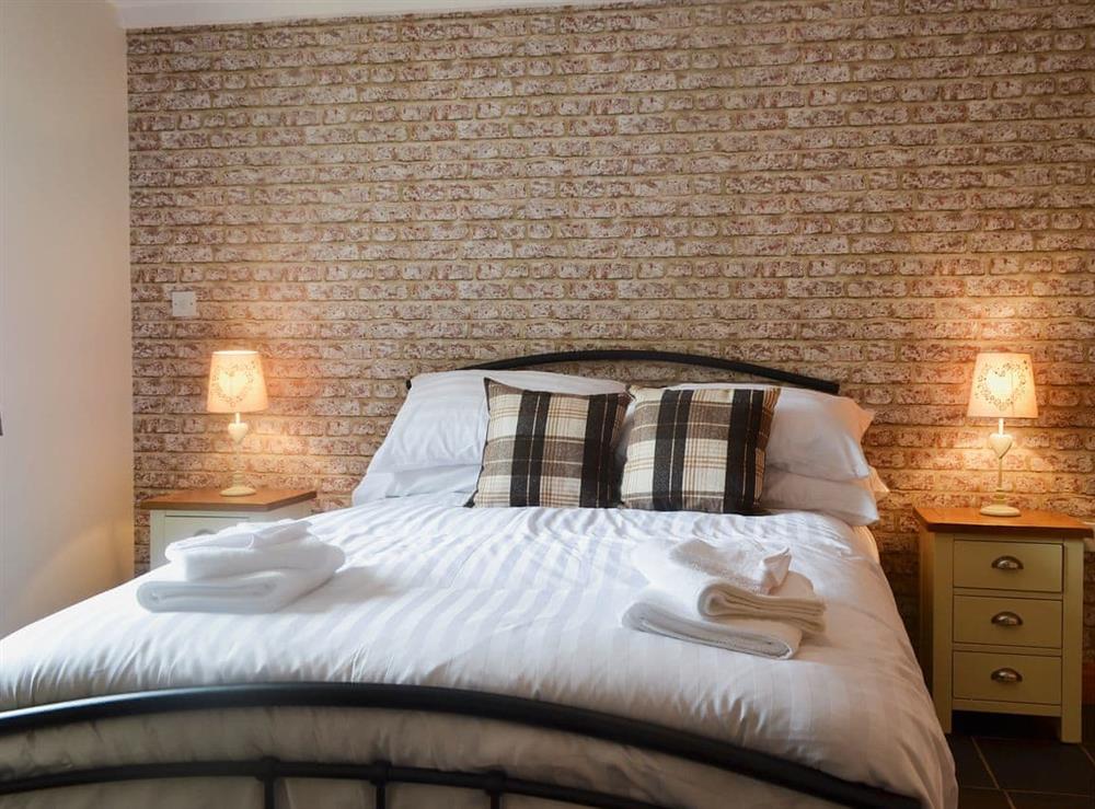 Relaxing double bedroom with en-suite shower room at Yr Hen Feudy, 