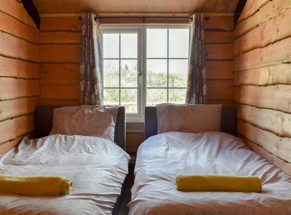 Twin bedroom at Brook Barn Farm Cabin in Liskeard, Cornwall
