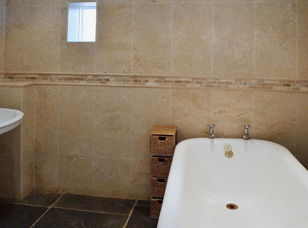 Stylish elegant bathroom boasting a roll top bath and shwer wet area at Brook Barn in Shobley, Ringwood, Hants., Hampshire