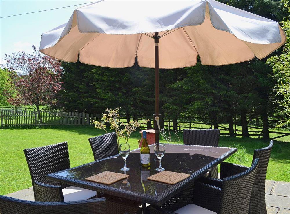 There is a large table for outdoor dining at Brook Barn in Shobley, Ringwood, Hants., Hampshire