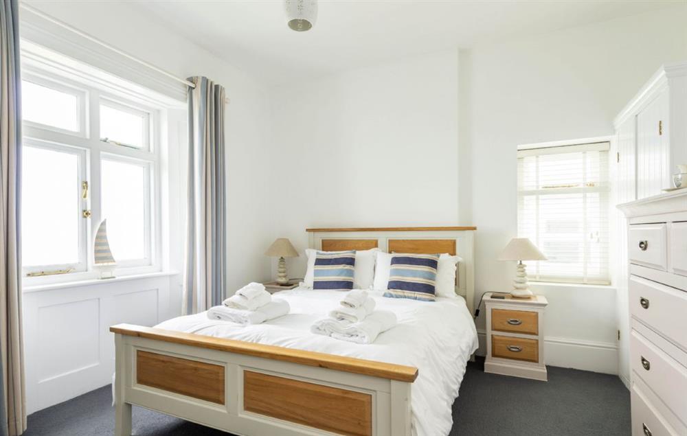 Bedroom with 5’ king-size bed at Brook Cottage (Cornwall), Trevose Head Lighthouse