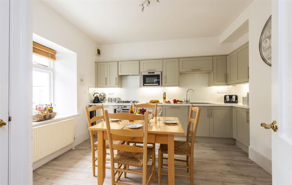 Spacious fully equipped kitchen with dining table (photo 2) at Brook Cottage (Cornwall), Trevose Head Lighthouse