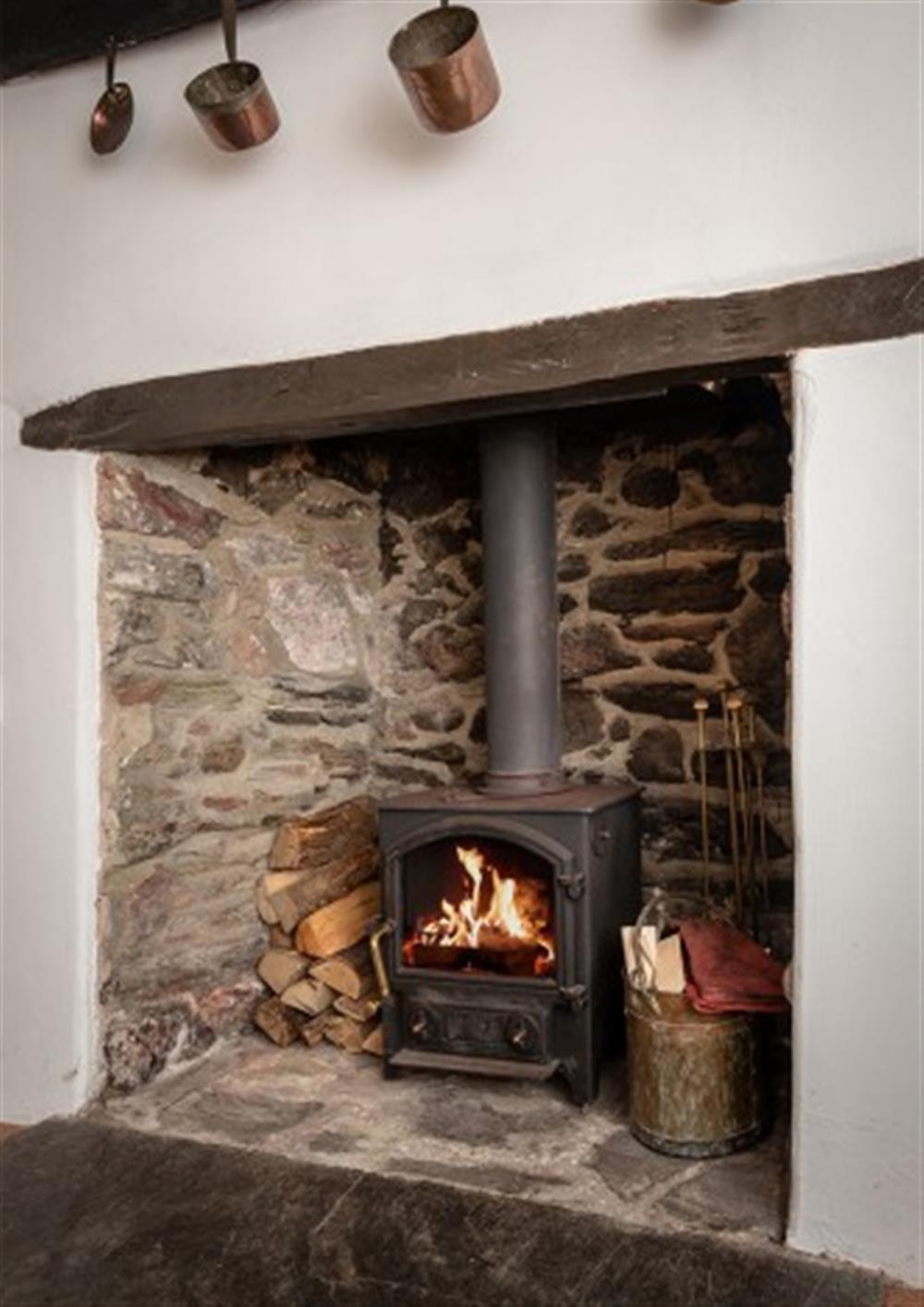 Cosy up in front of the log burner at Brook Cottage in Hope Cove