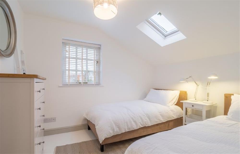 First floor: Bedroom three has full size twin beds at Brook House, Brinton near Melton Constable