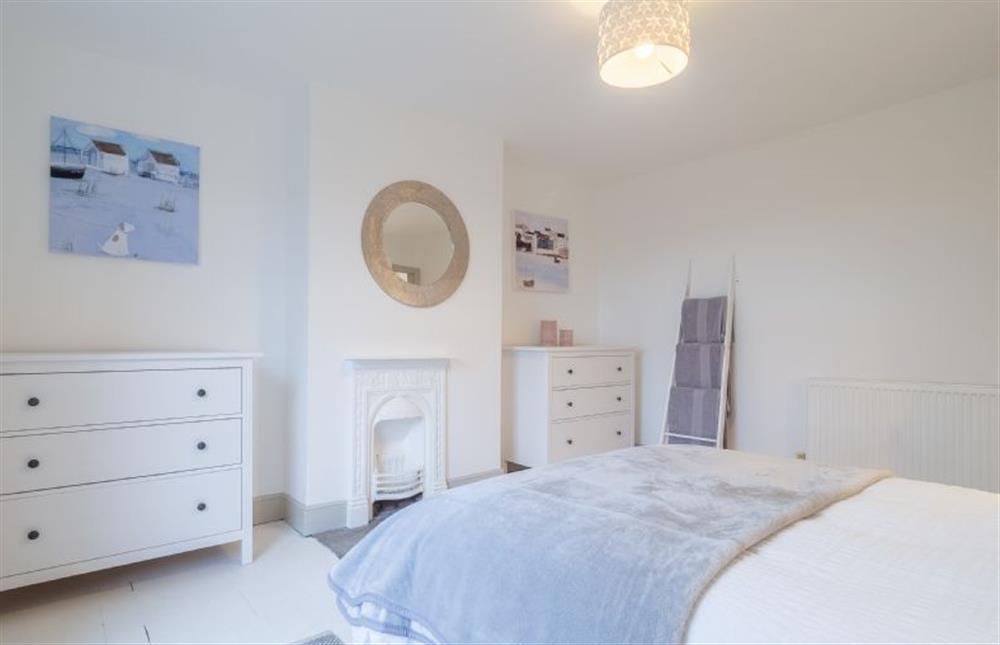 First floor: Bedroom two has comfy double bed at Brook House, Brinton near Melton Constable