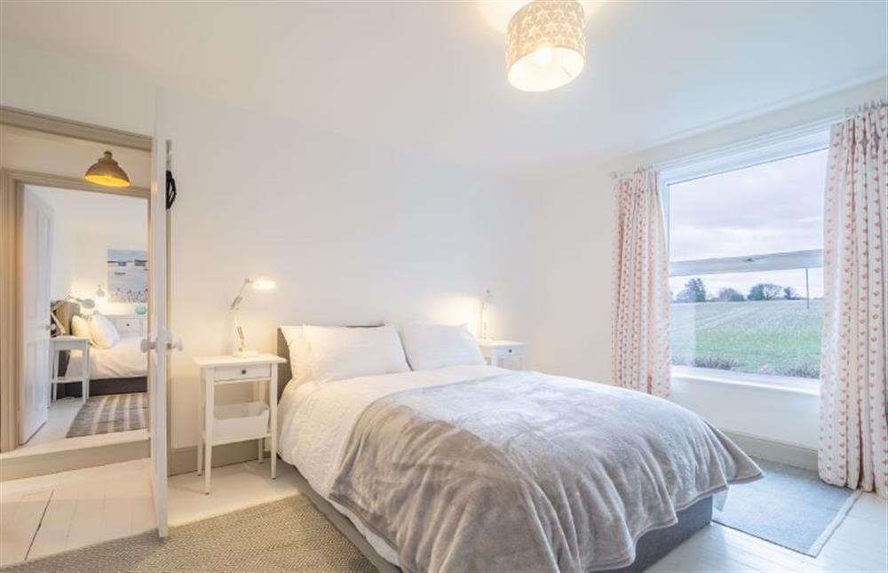 First floor: Bedroom two has countryside views at Brook House, Brinton near Melton Constable