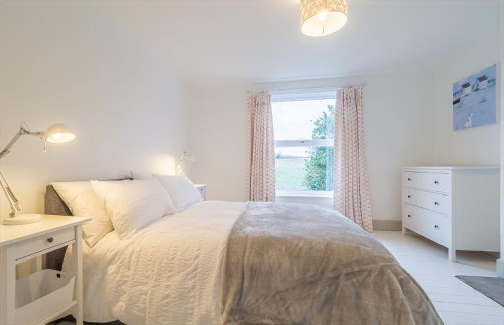 First floor: Stylish comfy bedroom two at Brook House, Brinton near Melton Constable