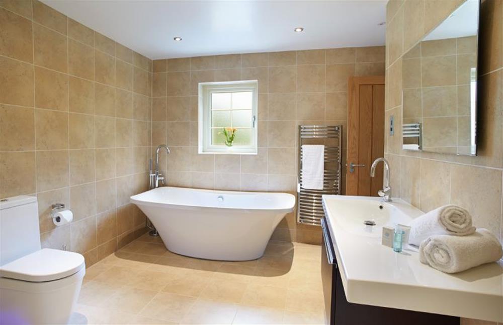 En-suite bathroom with separate shower (photo 2) at Brook Lodge, Colne Valley