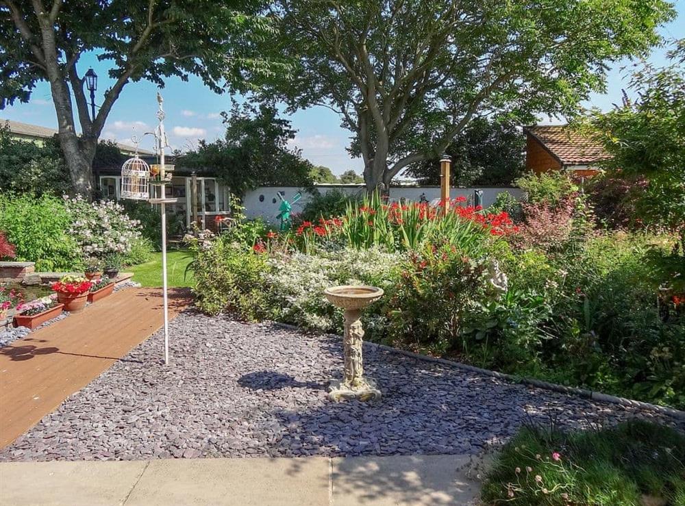 Beautiful landscaped shared garden at Brook Lodge Country Cottage in Wroot, near Doncaster, South Yorkshire