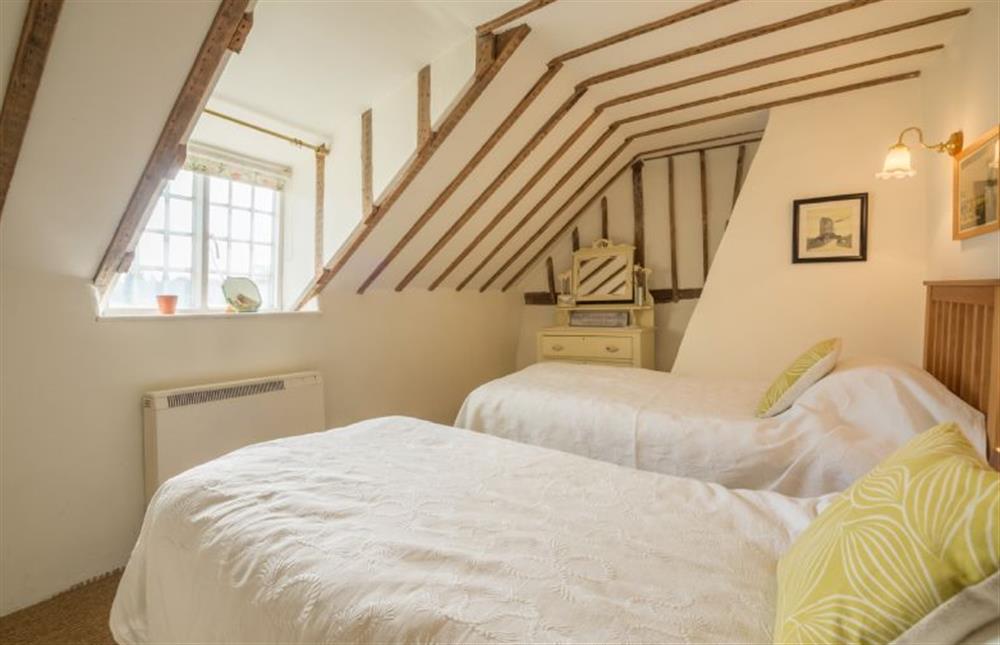 First floor: Bedroom two with twin beds at Brooke Cottage, Great Walsingham