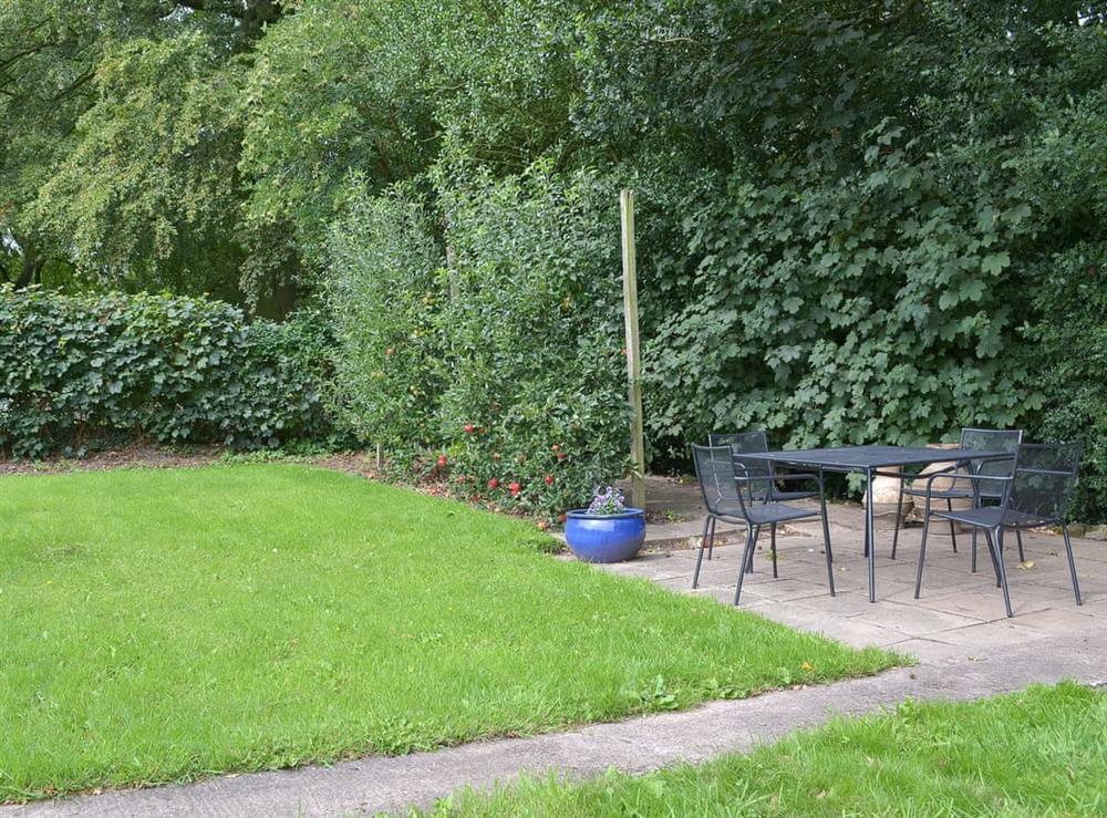 Lawned garden area with fruit trees at Jasmine Cottage, 