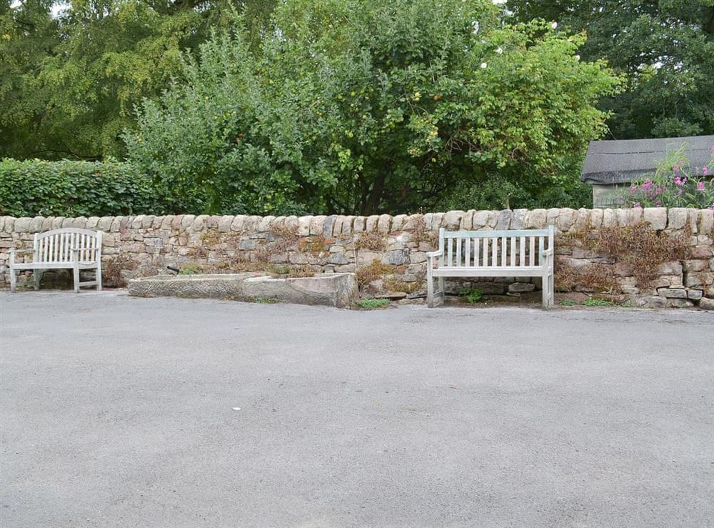 Seating area below the well established apple tree at Jasmine Cottage, 
